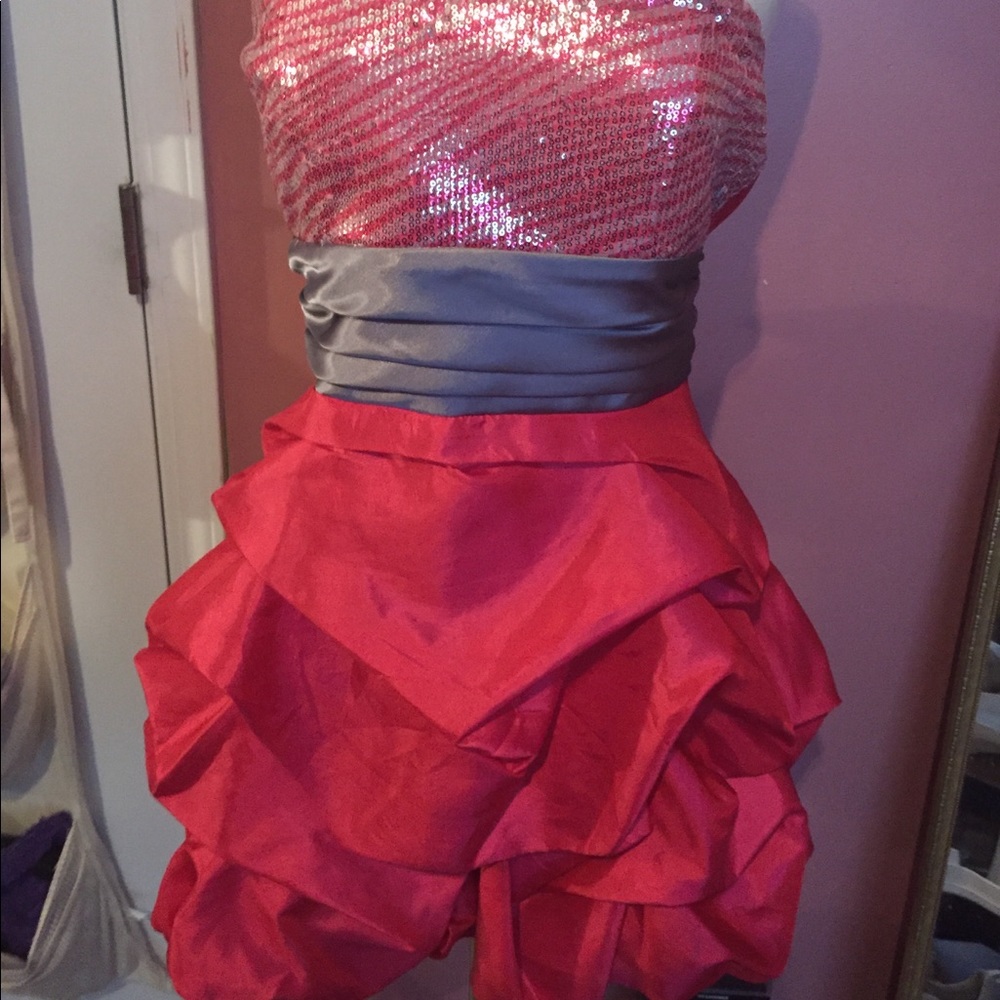 Pink and silver cocktail prom dress with a bow.